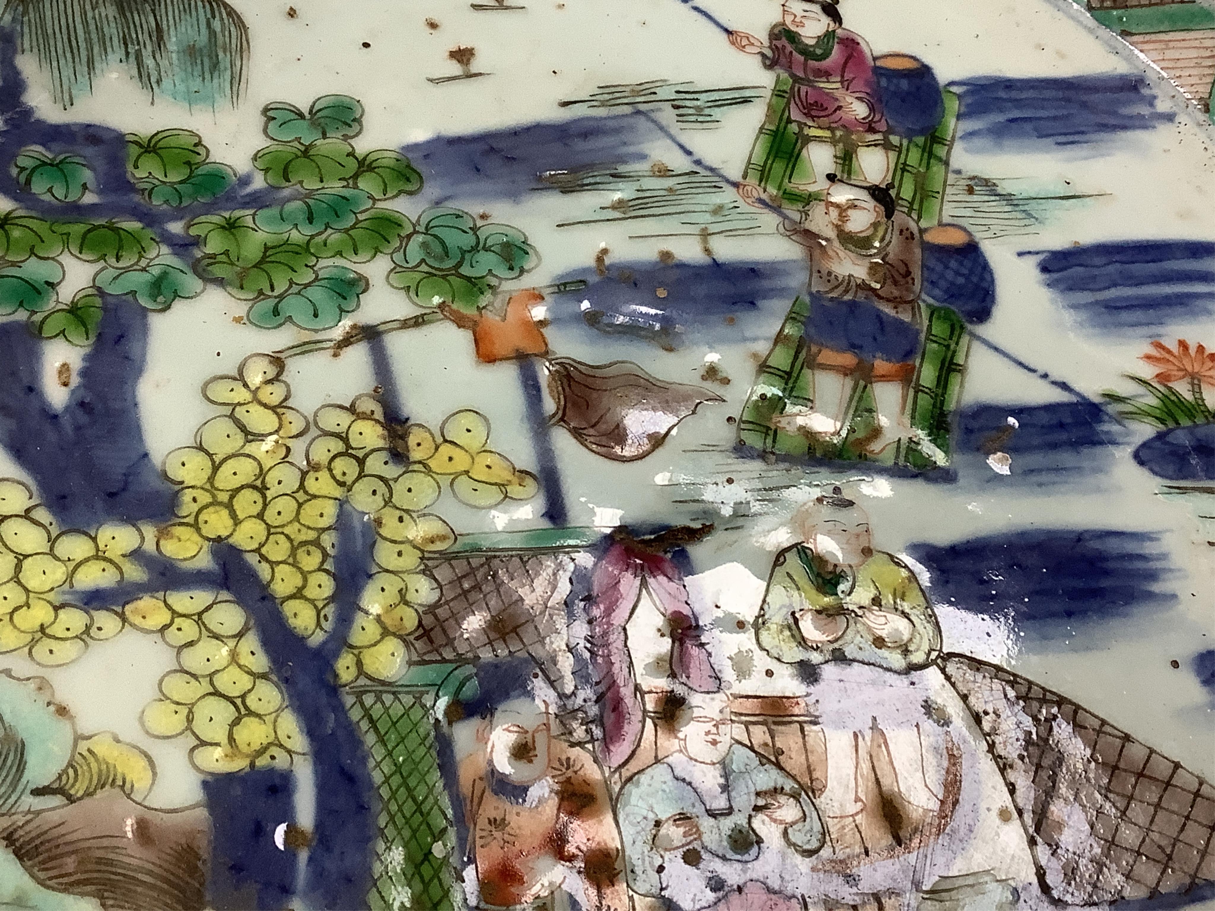 A large Chinese porcelain basin enamelled with figures, 41cm in diameter